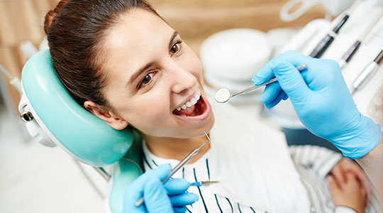 A girl smiling while dental checkup